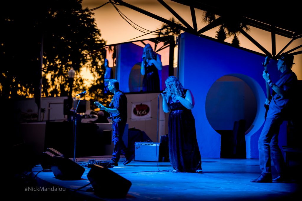 Julie Black & Her Band captured in blue lights on stage at the 2023 Chasco Fiesta Festival New Port Richey Florida